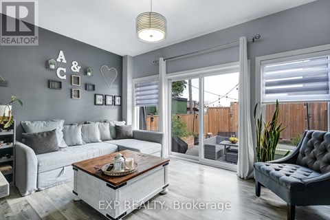 A living room with a grey couch and a coffee table.