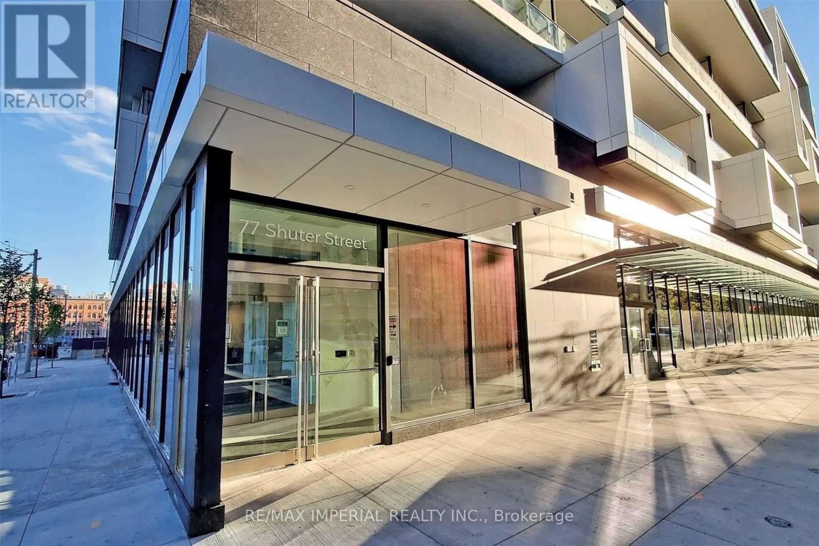A modern building with glass doors and windows is the brokerage of REMAX Imperial Realty Inc.