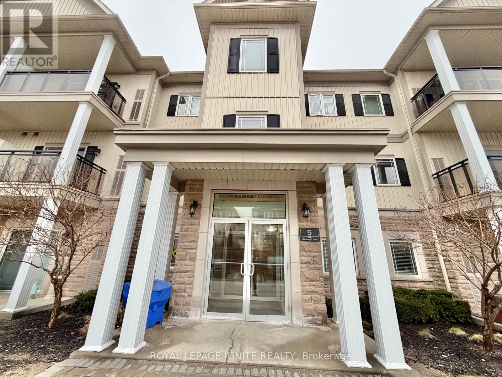 A building with a Royal LePage Fenton Realty sign in front.