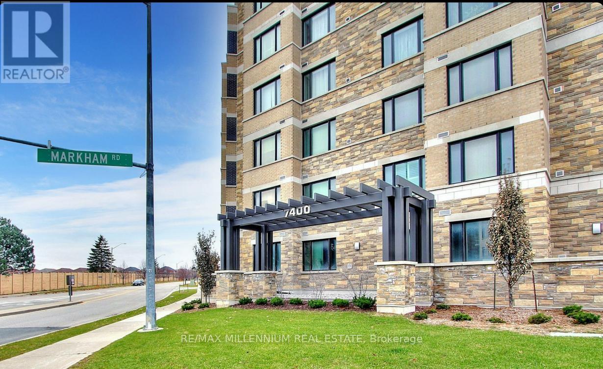 A tall building with a sign that says "RE/MAX Millennium Real Estate Brokerage" in front of it.
