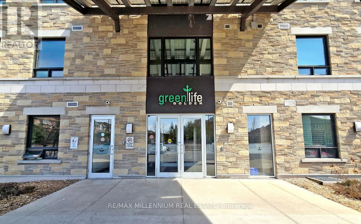 The front of a building with a greenLife sign on it.