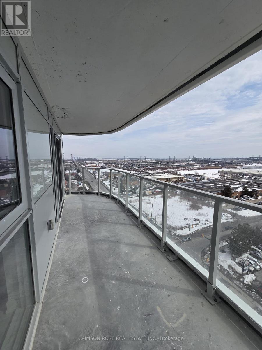 A view from a high-rise building looking out over a cityscape.