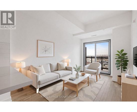 A well-lit living room with a large window and a view of the city.