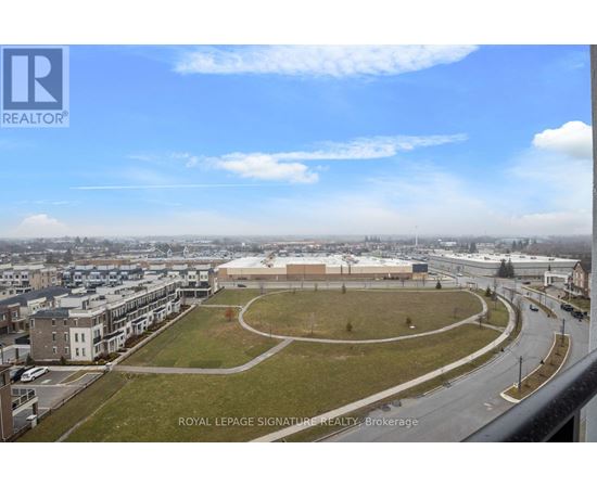 A view of a city from a high vantage point with a large building in the center.