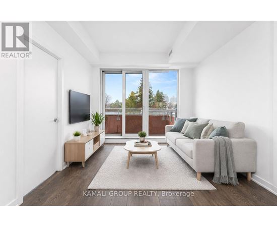 A living room with a couch, a television, and a coffee table.
