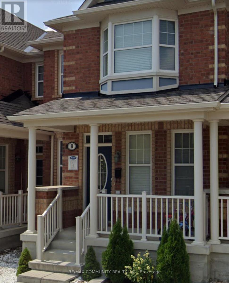 A house with a porch and a mailbox on the front door.