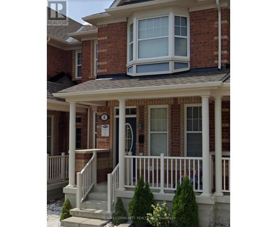 A house with a porch and a mailbox on the front door.