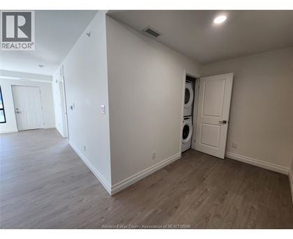 A room with a washer and dryer in it.