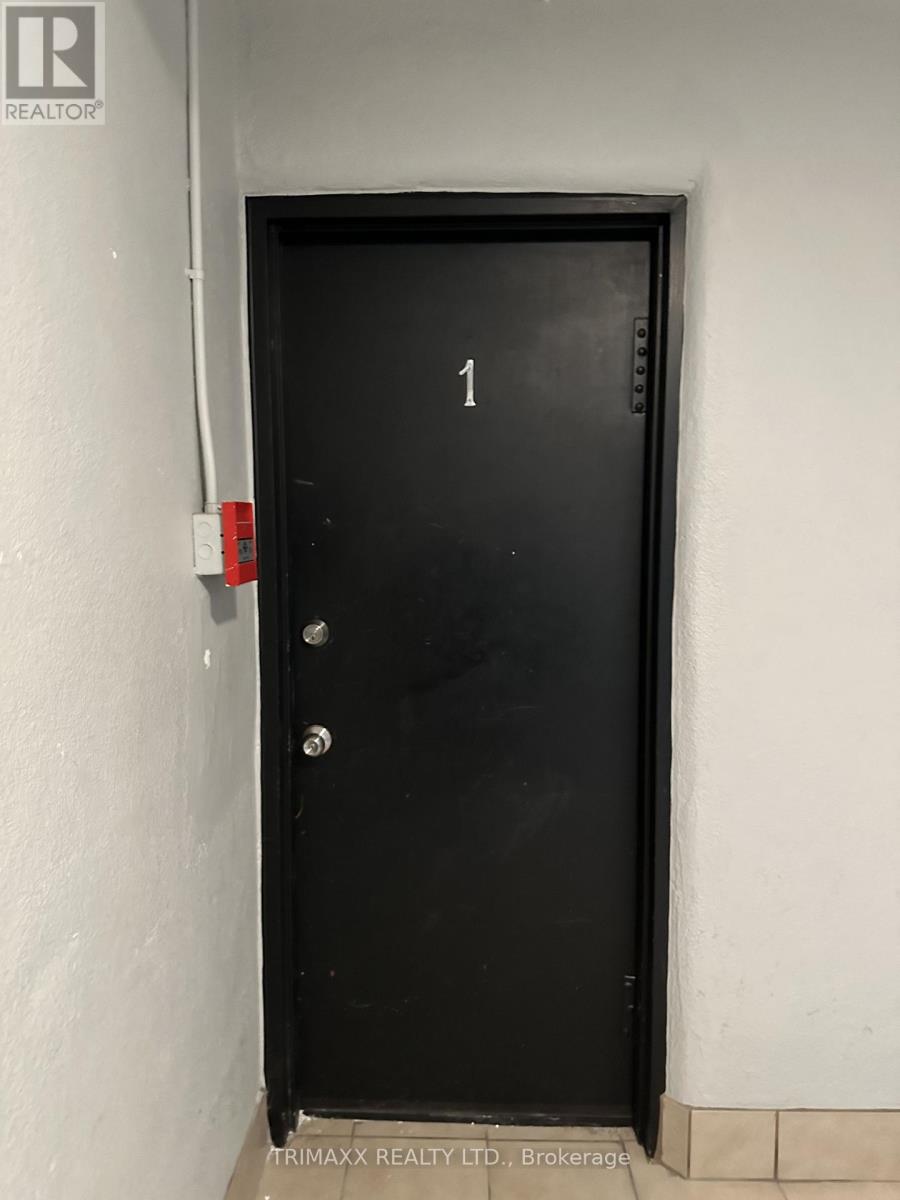 A black door with the number 1 on it.