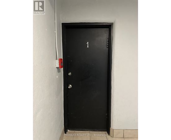 A black door with the number 1 on it.