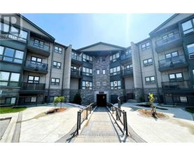 A sunny day at a modern apartment complex with a central courtyard.
