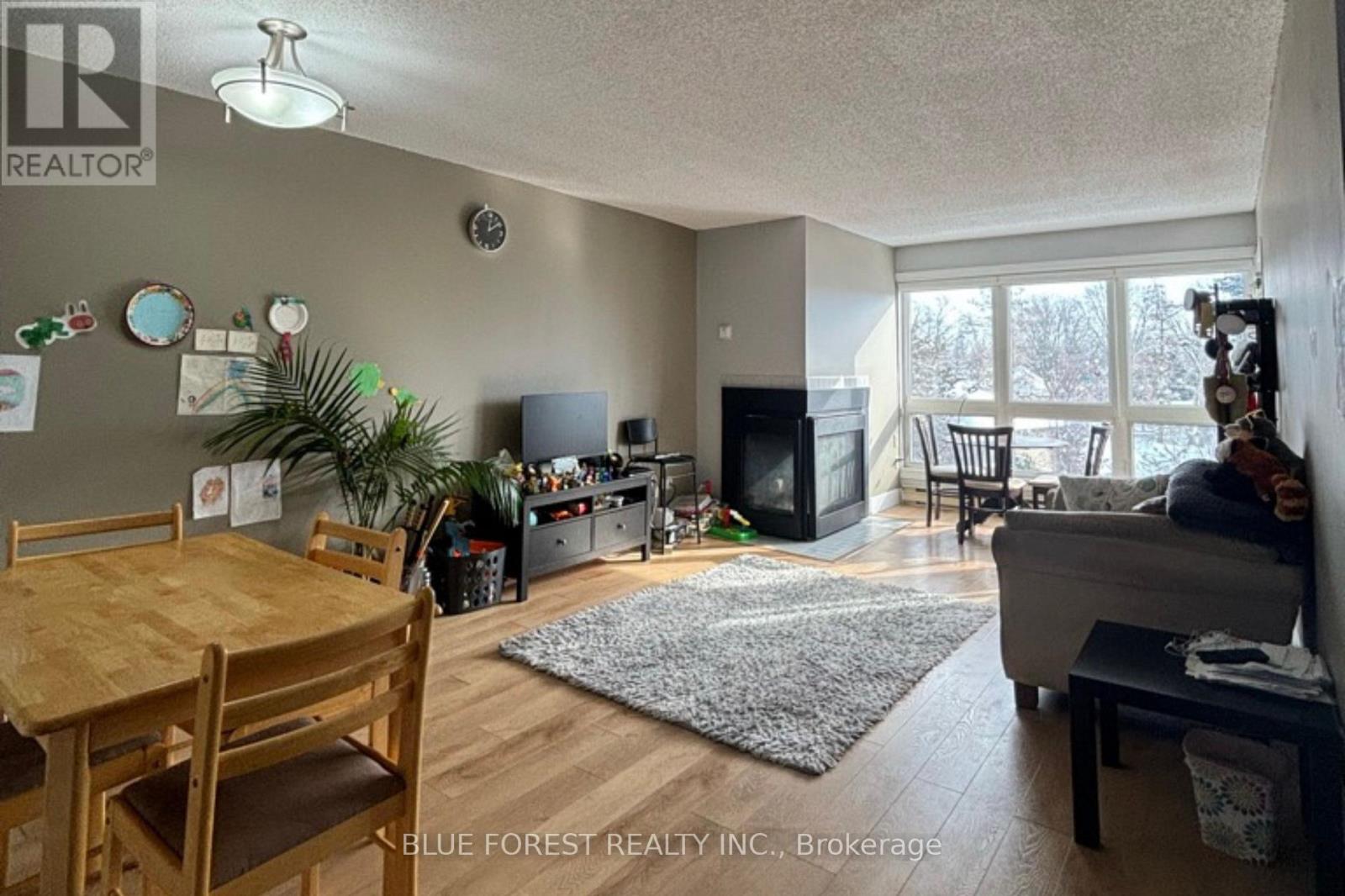 A living room with a dining table and chairs.