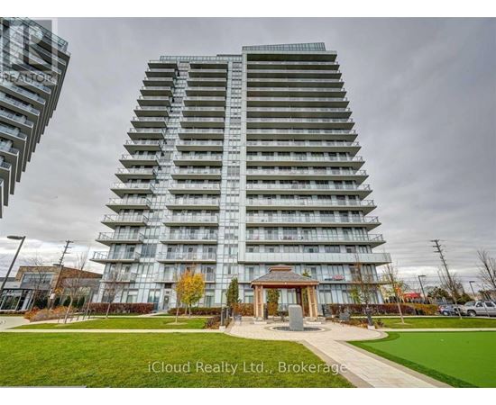 A tall residential building with a gazebo-like structure in front.