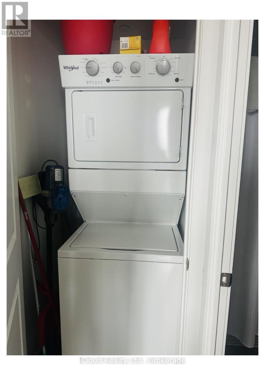 A white Whirlpool oven and dishwasher combo in a small kitchen.