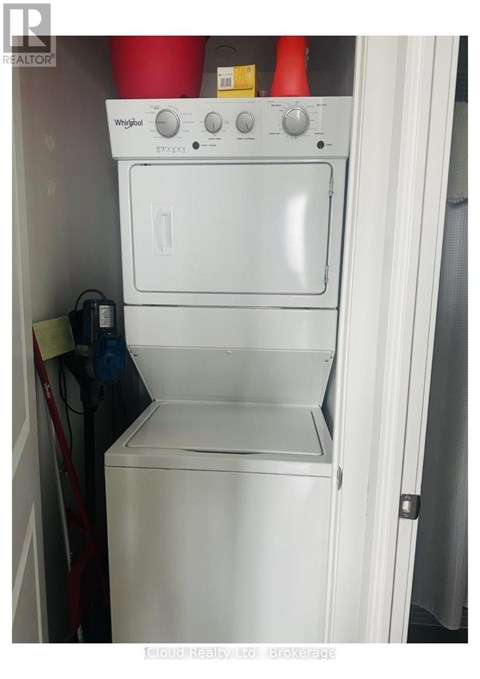 A white Whirlpool oven and dishwasher combo in a small kitchen.