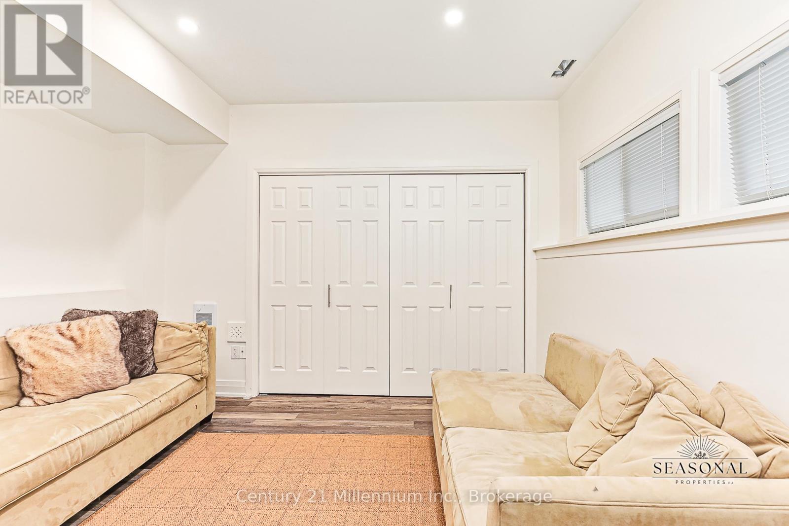 A living room with a couch and a door.