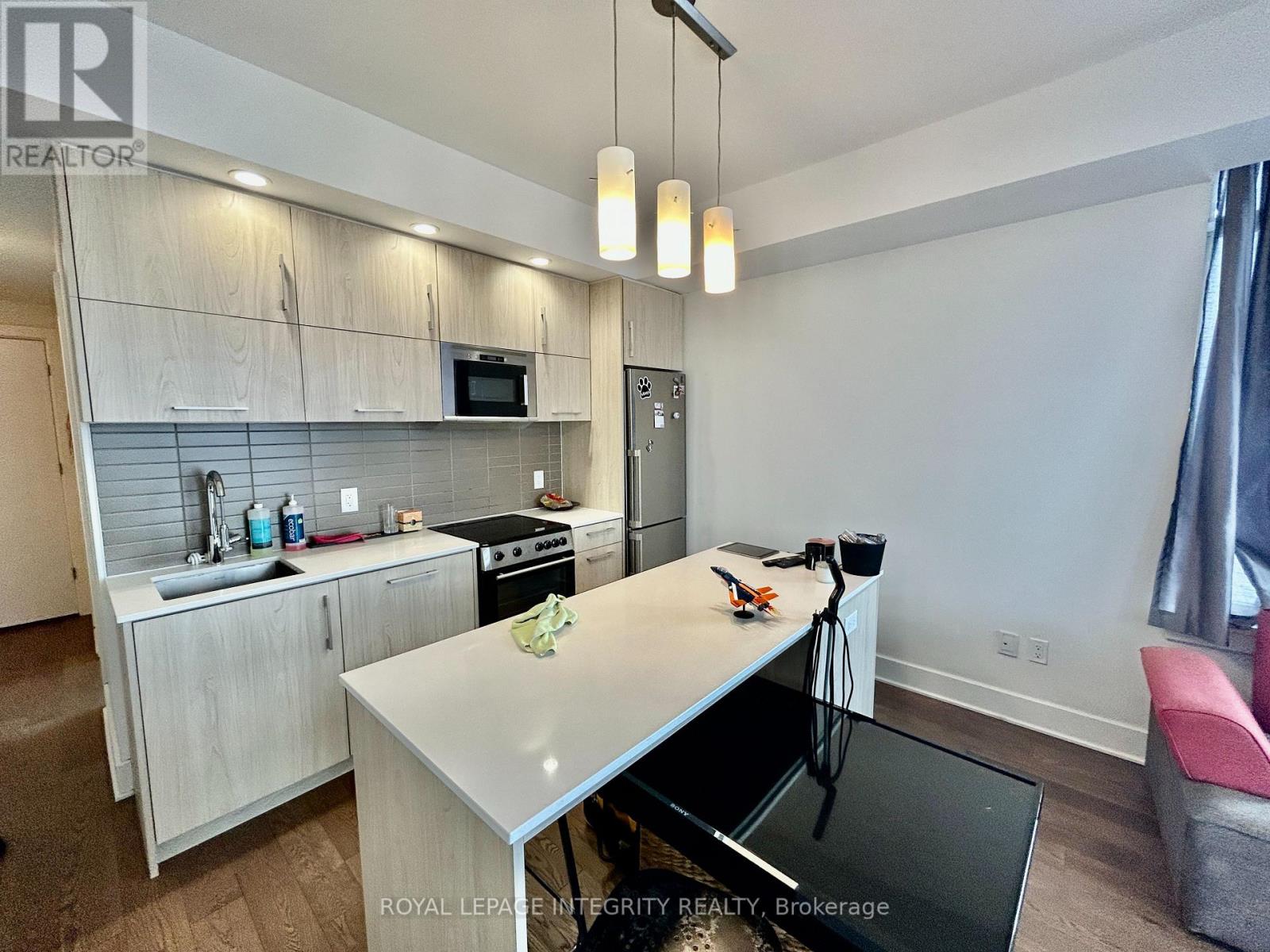 A modern kitchen with a breakfast bar.