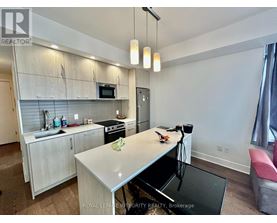 A modern kitchen with a breakfast bar.