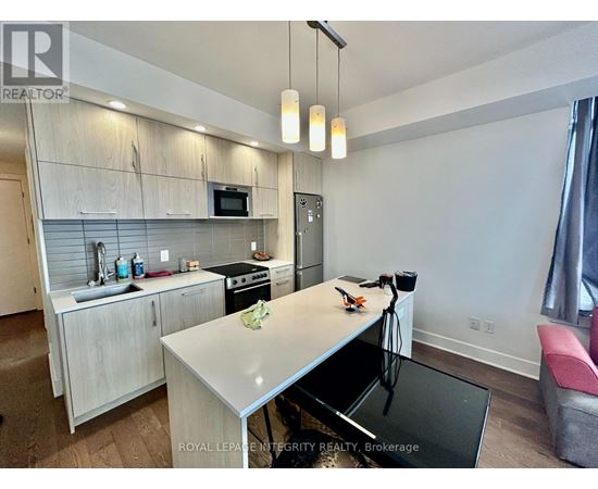 A modern kitchen with a breakfast bar.