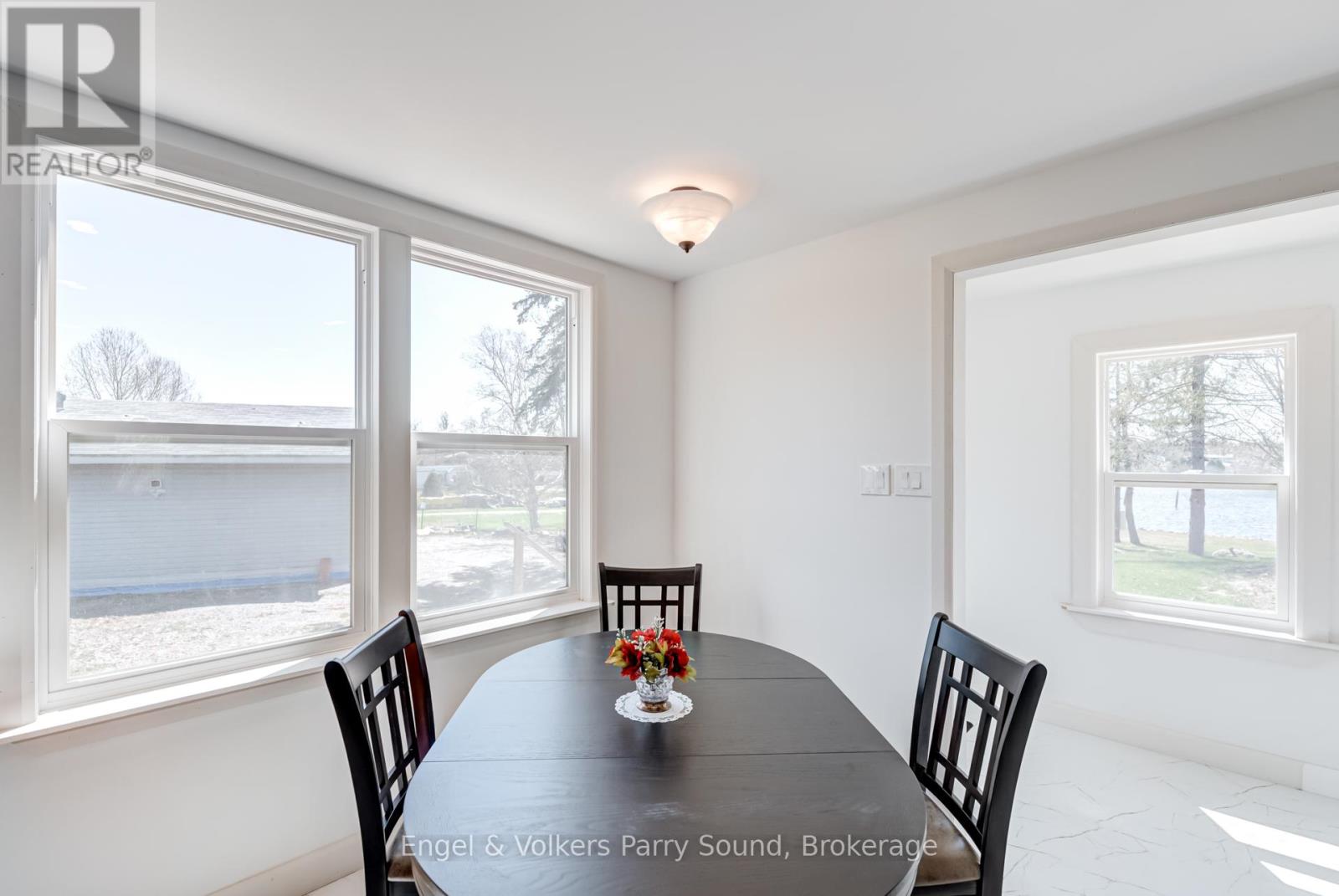 A dining room with a table set for two.