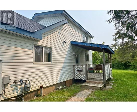 A house with a porch and a covered entrance.