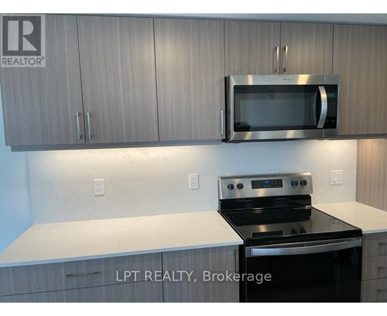A kitchen with a stove top oven and microwave above it.