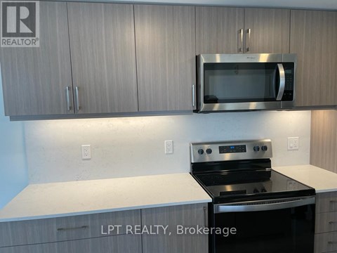 A kitchen with a stove top oven and microwave above it.