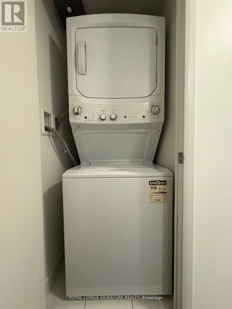 A white washing machine in a small space.