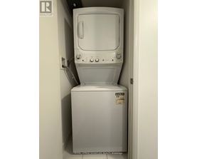 A white washing machine in a small space.