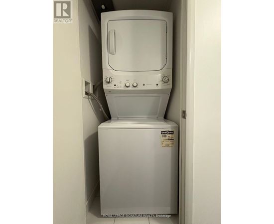 A white washing machine in a small space.