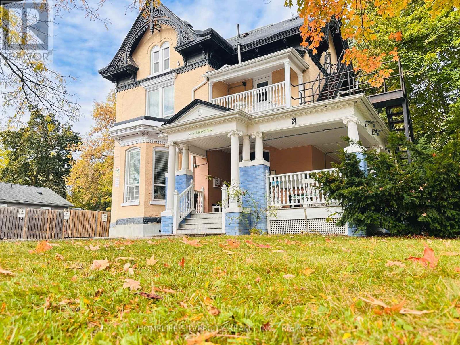 A large house with a balcony and a porch.