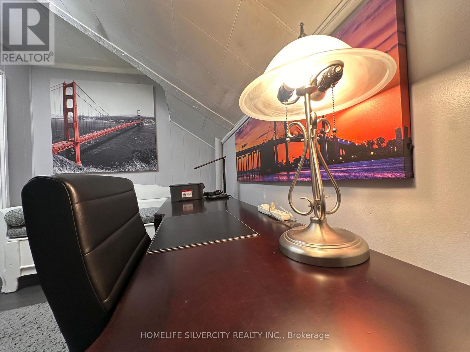 A conference room with a bridge picture on the wall.