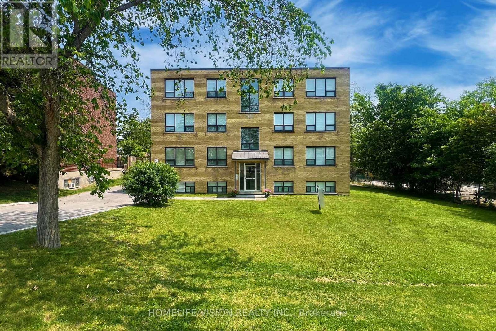 A building with a lawn in front of it.