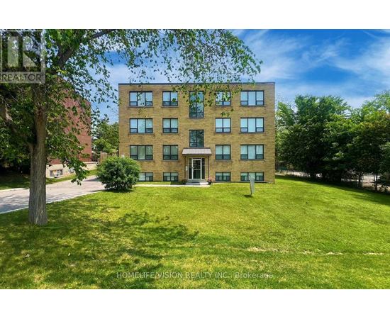 A building with a lawn in front of it.