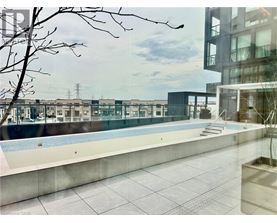 A pool area with a building in the background.