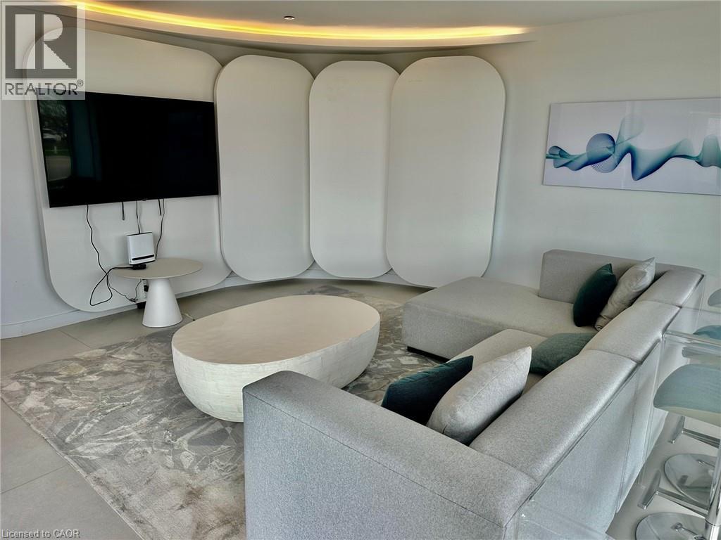 A modern living room with a grey sofa and a white coffee table.