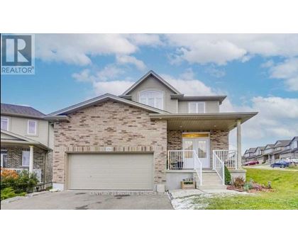 A house with a garage is for sale.