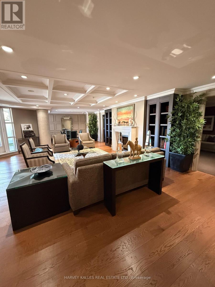 A spacious living room with a large sofa set and a coffee table.