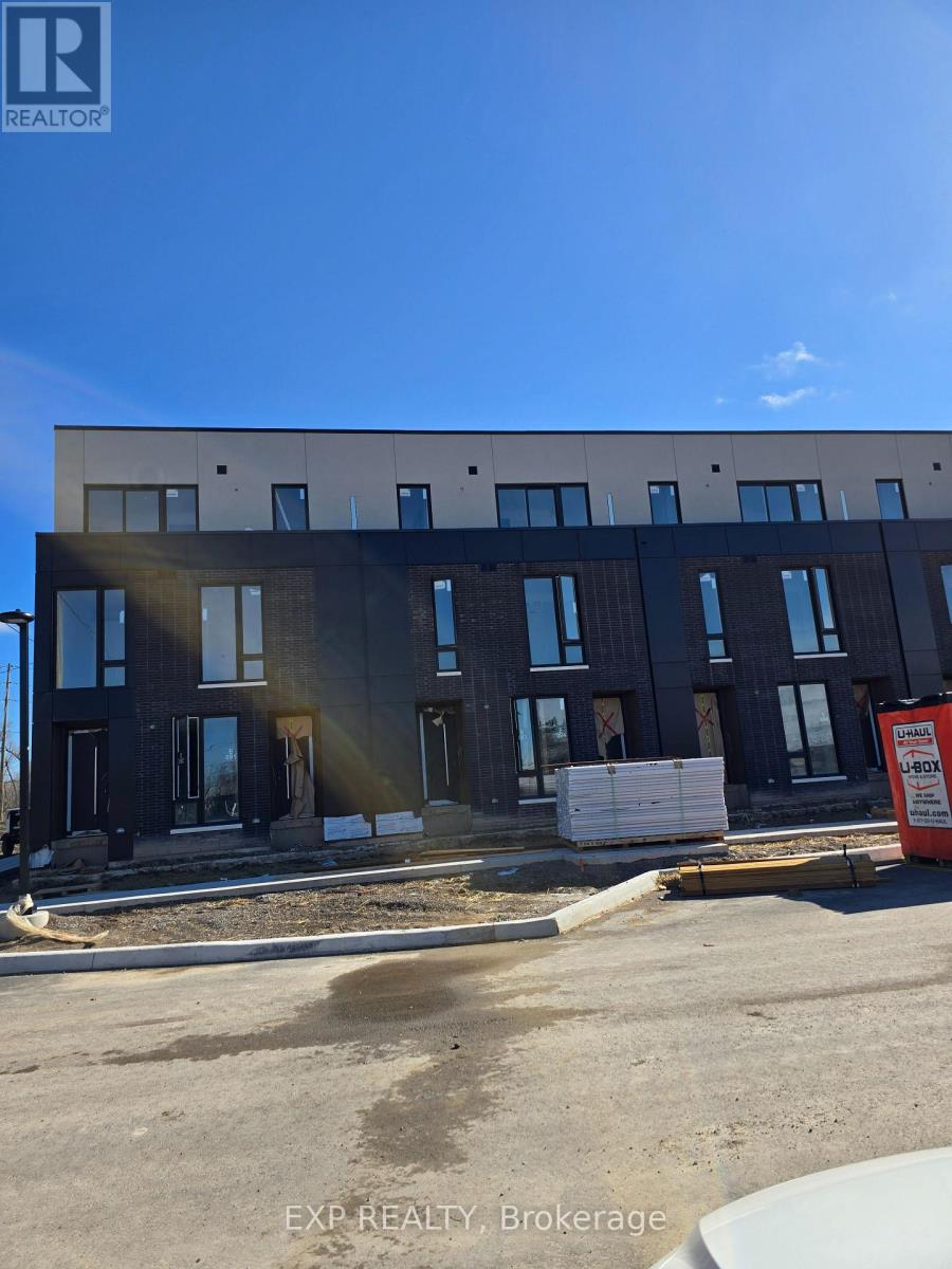 A building under construction with a sign that says "EXP REALTY Brokerage".