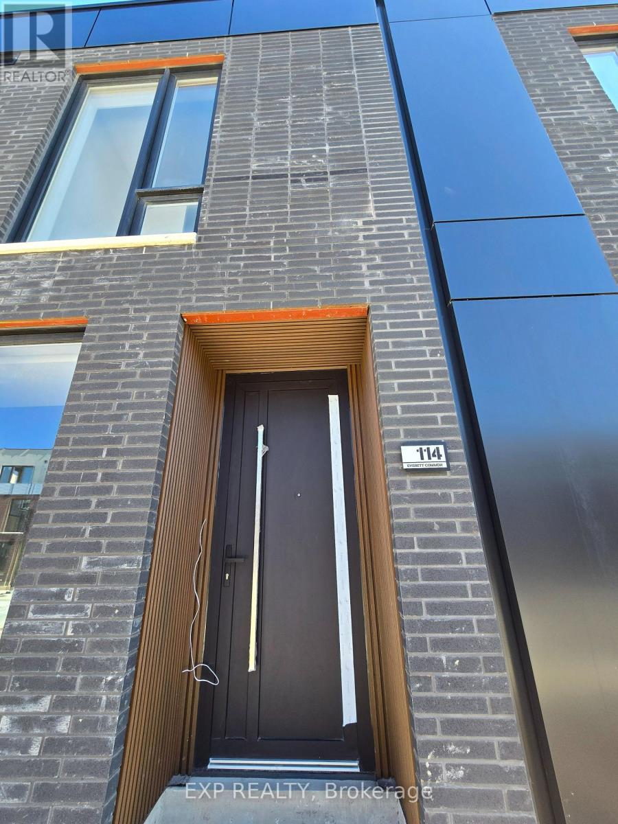 A modern building with a black door and windows.