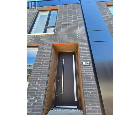 A modern building with a black door and windows.