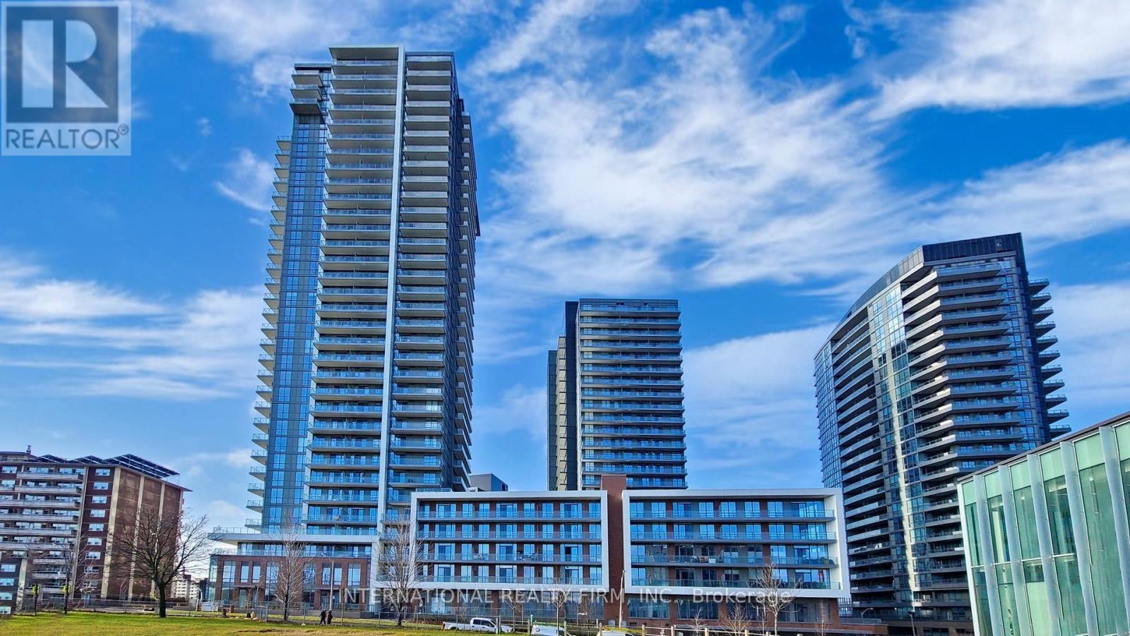 A cityscape with a clear blue sky and buildings of various heights.