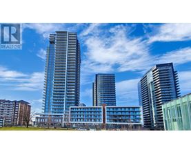 A cityscape with a clear blue sky and buildings of various heights.