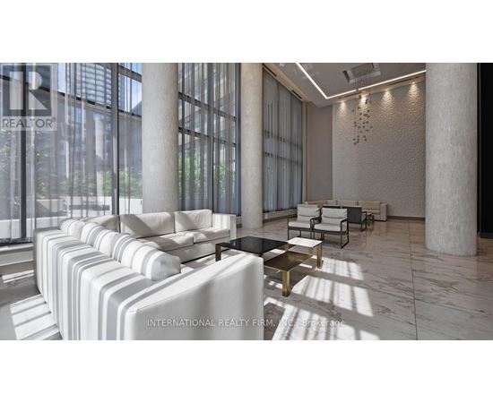 A modern living room with white furniture and large windows.