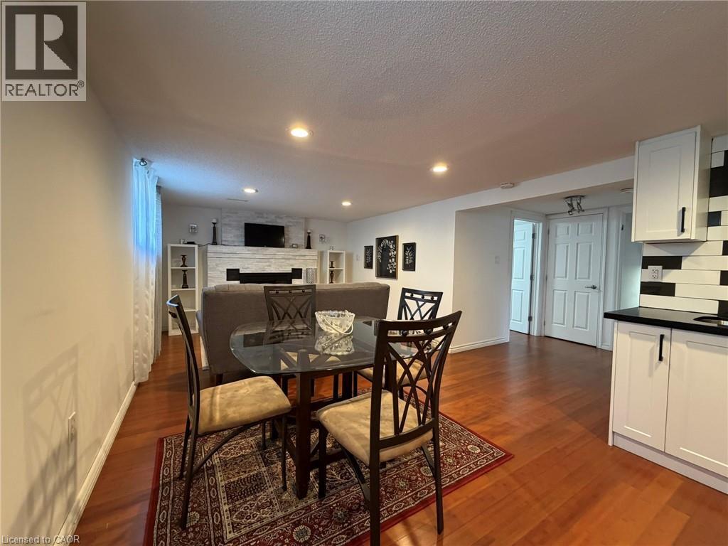 A dining room with a table set for two.
