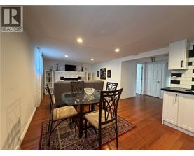 A dining room with a table set for two.