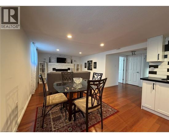 A dining room with a table set for two.