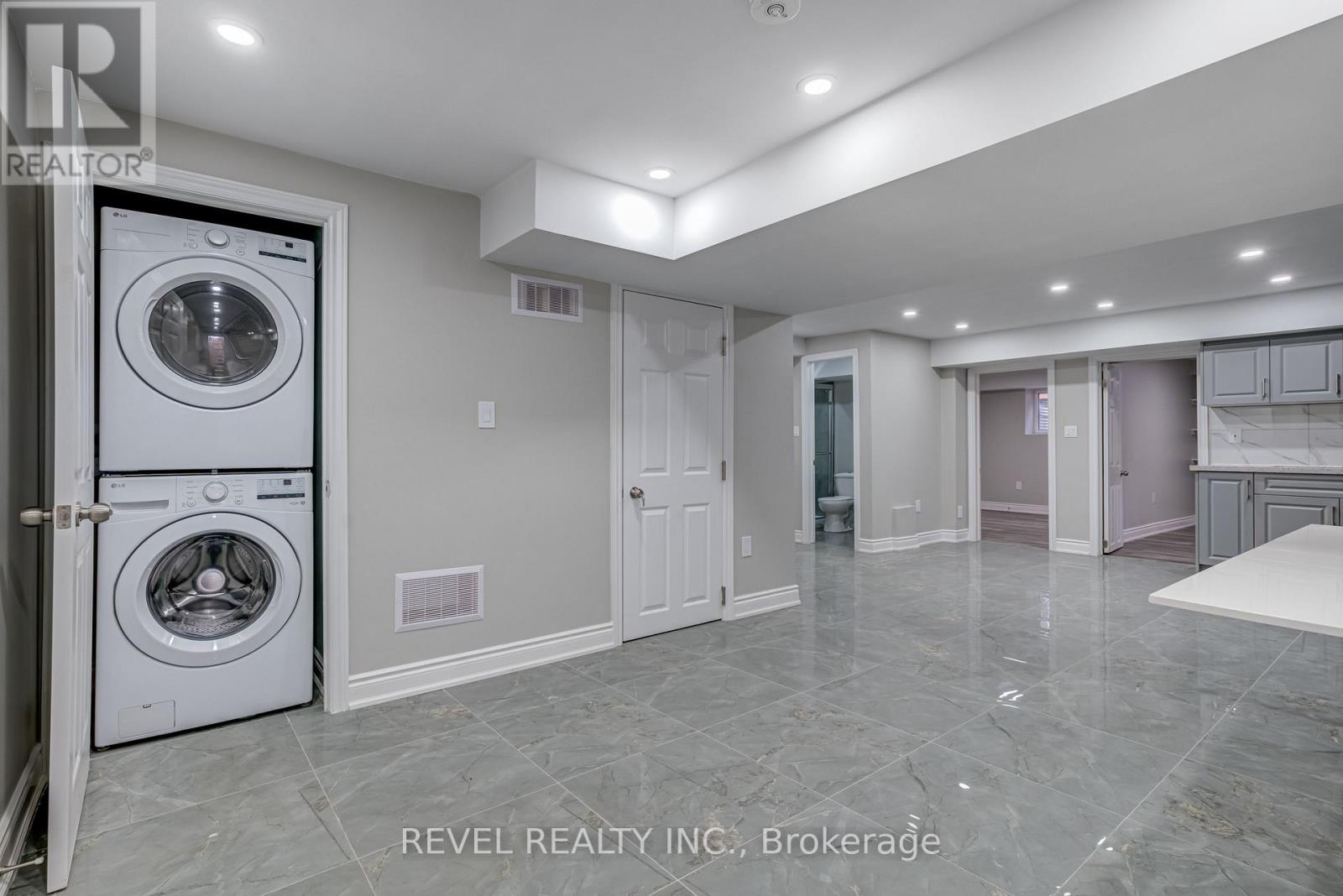 A laundry room with a washer and dryer in it.