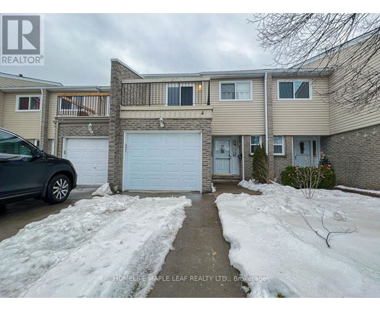 A house with a car parked in front of it.