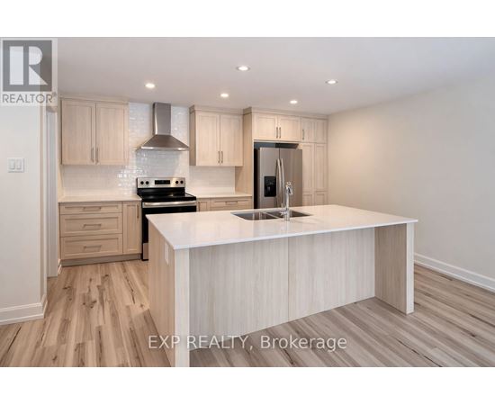 A kitchen with a white countertop and wooden cabinets.